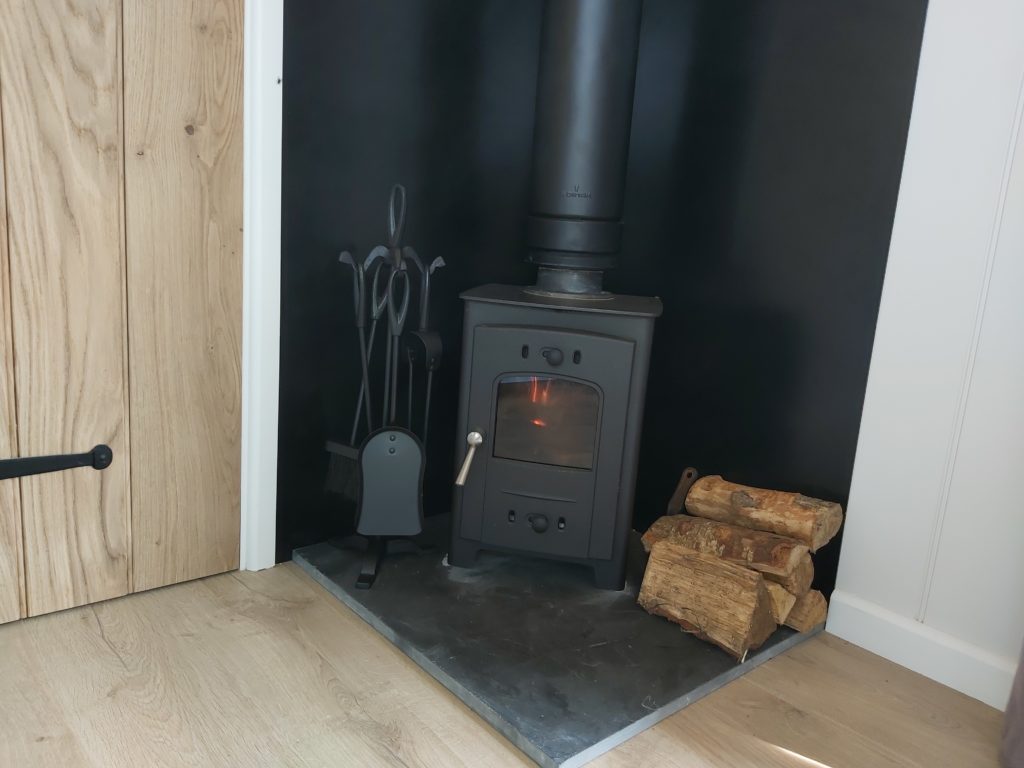 Log burner with seasoned timber which is more eco friendly that gas or oil heating.